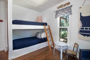 En eller flere senge i et værelse på Sea Island Cotton Cottage