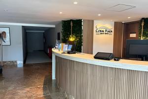 a bar in a hotel lobby with a television at Cobertura em Hotel de Luxo na Beira Mar in Natal +31 photos