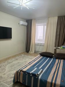 Giường trong phòng chung tại Абая 244