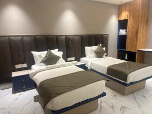 Ένα ή περισσότερα κρεβάτια σε δωμάτιο στο Pinky Hotel