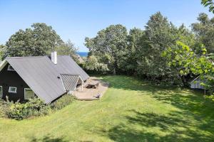 an aerial view of a house with a yard at 6843-Allinge-Lundegardsvej-16-B in Sandkås