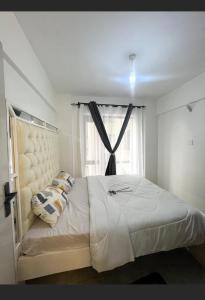 Giường trong phòng chung tại Feelhome-Warm cozy modern one bedroom