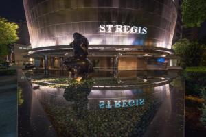 a building with a statue in front of it at The St Regis Singapore in Singapore