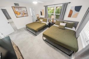 Ένα ή περισσότερα κρεβάτια σε δωμάτιο στο Progresso Apartments & Homes by Lowkl