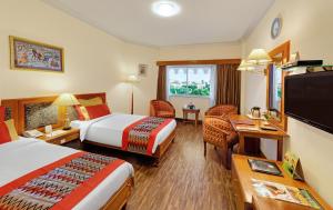 Ambassador Ajanta Hotel, Aurangabad的电视和/或娱乐中心