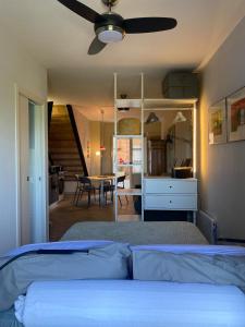 a bedroom with a bed with a ceiling fan at Casa Danesi in Monteleone dʼOrvieto