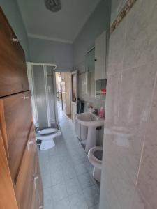 a bathroom with two toilets and a sink at La Casetta dei Monti Lepini in Segni