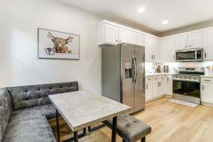 a kitchen with a couch and a table and a refrigerator at Lake-View Retreat with Games and Yard in Daingerfield in Lone Star