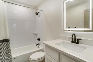 a white bathroom with a sink and a toilet at Lake-View Retreat with Games and Yard in Daingerfield in Lone Star +19 photos
