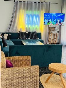 a living room with a couch and a table at Spacious and comfortable villa in Marrakesh