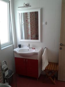 Ванна кімната в Apartments Odiva