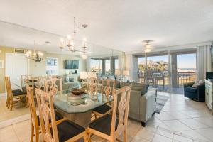a dining room and living room with a dining table at Magnolia House at Destin Pointe 203 in Destin +21 photos