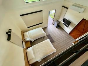 an overhead view of a room with two beds at Nature Peace Home in U Thong