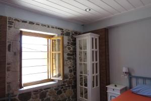 Postel nebo postele na pokoji v ubytování Mystras Inn