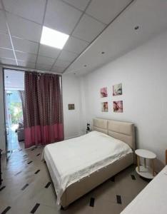 Ένα ή περισσότερα κρεβάτια σε δωμάτιο στο Center House