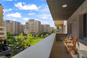 an apartment balcony with a view of a city at SB Nest Apartment in Braşov