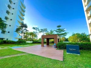 a pavilion in a park next to a building at L Studio by Sella in Manila