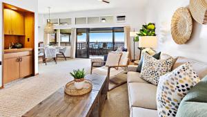 a living room with a couch and a table at Kapalua Ridge Villa 1624 in Kapalua +41 photos
