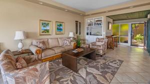 a living room with a couch and a table at Kapalua Ridge Villa 1112 in Kapalua
