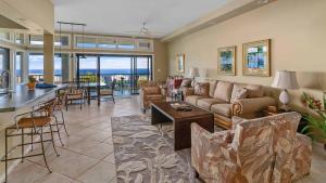 a living room with a couch and a table at Kapalua Ridge Villa 1112 in Kapalua