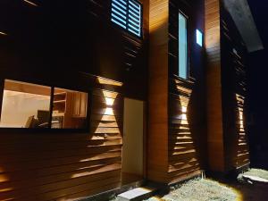 a building with a window on the side of it at Beautiful Cabin in Pucon 4D3B in El Cerrillo