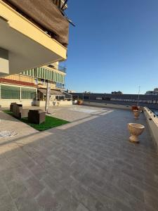 an empty courtyard of a building with a large building at Dello Iacono suite in Naples