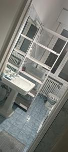 a view of a bathroom with a sink and a toilet at PRATE48 in Bologna