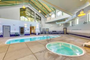 a large indoor swimming pool with a hot tub at Close to Rocky Mtn Slopes! Cozy Silverthorne Condo in Sentinel Island