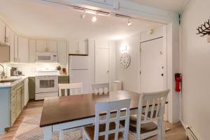 a kitchen with a dining room table and chairs at Close to Rocky Mtn Slopes! Cozy Silverthorne Condo in Sentinel Island