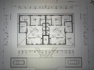 a drawing of a floor plan of a house at Ferienhäuser Wintermoor in Schneverdingen