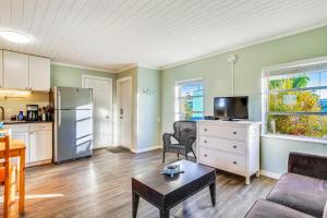 a living room with a couch and a table at Fisherman's Bungalow in Conch Key