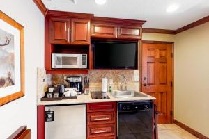 a kitchen with a sink and a microwave at Westgate Charm #4814B in Park City