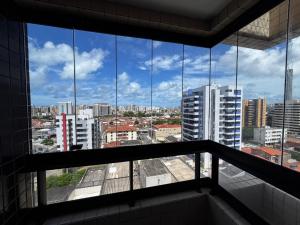 a view of a city from a window in a building at Apartamentos Renovatio Jatiuca - Castelo B Temporada in Maceió