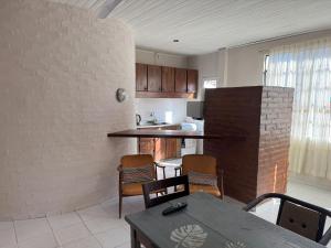 a kitchen and dining room with a table and chairs at Colon 533A in Reconquista