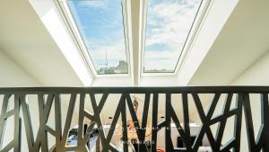 a view from the balcony of a room with a window at KILIANA Appartement 3 chambres centre ville et 100m de la mer Concarneau in Concarneau