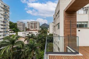 an apartment balcony with a view of a city at Apê com piscina e academia: Metrô 350m in Rio de Janeiro