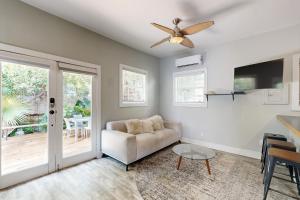 a living room with a couch and a ceiling fan at Bottoms Up in Key West