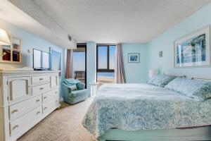 a bedroom with a bed and a dresser and a window at Sea Colony - 505 Chesapeake House Rd in Sea Colony +35 photos