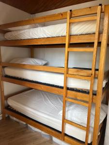 a set of bunk beds in a room at appartement cocooning ski au pied in Vars +30 photos