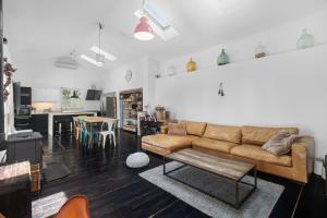 a living room with a couch and a table at Scuola Roveria in Juršići