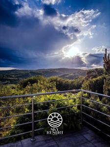 a view of the hills from the balcony of a house at Sky Resort  +21 photos