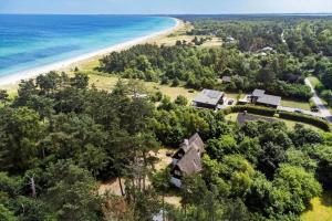 an aerial view of a house next to a beach at 20156-Samso-Skovvejen-9-B in Mårup