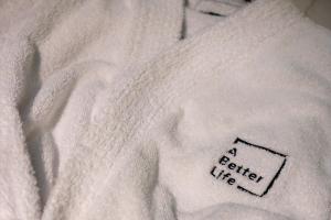 a white sweater with the words better like on it at The Powder Post Capitol Peak Lodge #3225 in Snowmass Village