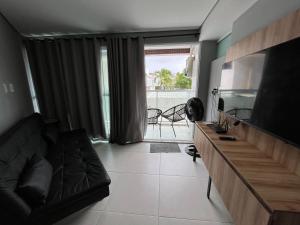 TV a/nebo společenská místnost v ubytování Conforto beira mar Flamboyant