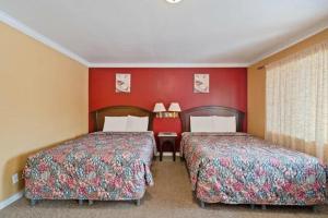 Postel nebo postele na pokoji v ubytování Hotel Beeville -US 181