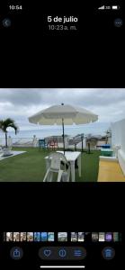 a view of a table with an umbrella at Habitación privada in Crucita