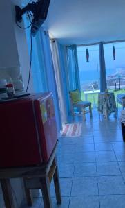 a living room with a view of the ocean at Habitación privada in Crucita