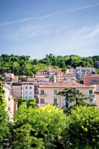 a group of buildings in a city with trees at Hotel della Vittoria in Ancona