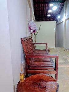 a wooden chair sitting on a table in a room at Casa na Chapad Diamantina Andaraí - Igatu in Andaraí