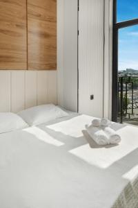 Postel nebo postele na pokoji v ubytování Уютная квартира стиле минимализм ЖК Prestige Gardens + 20 fotografií